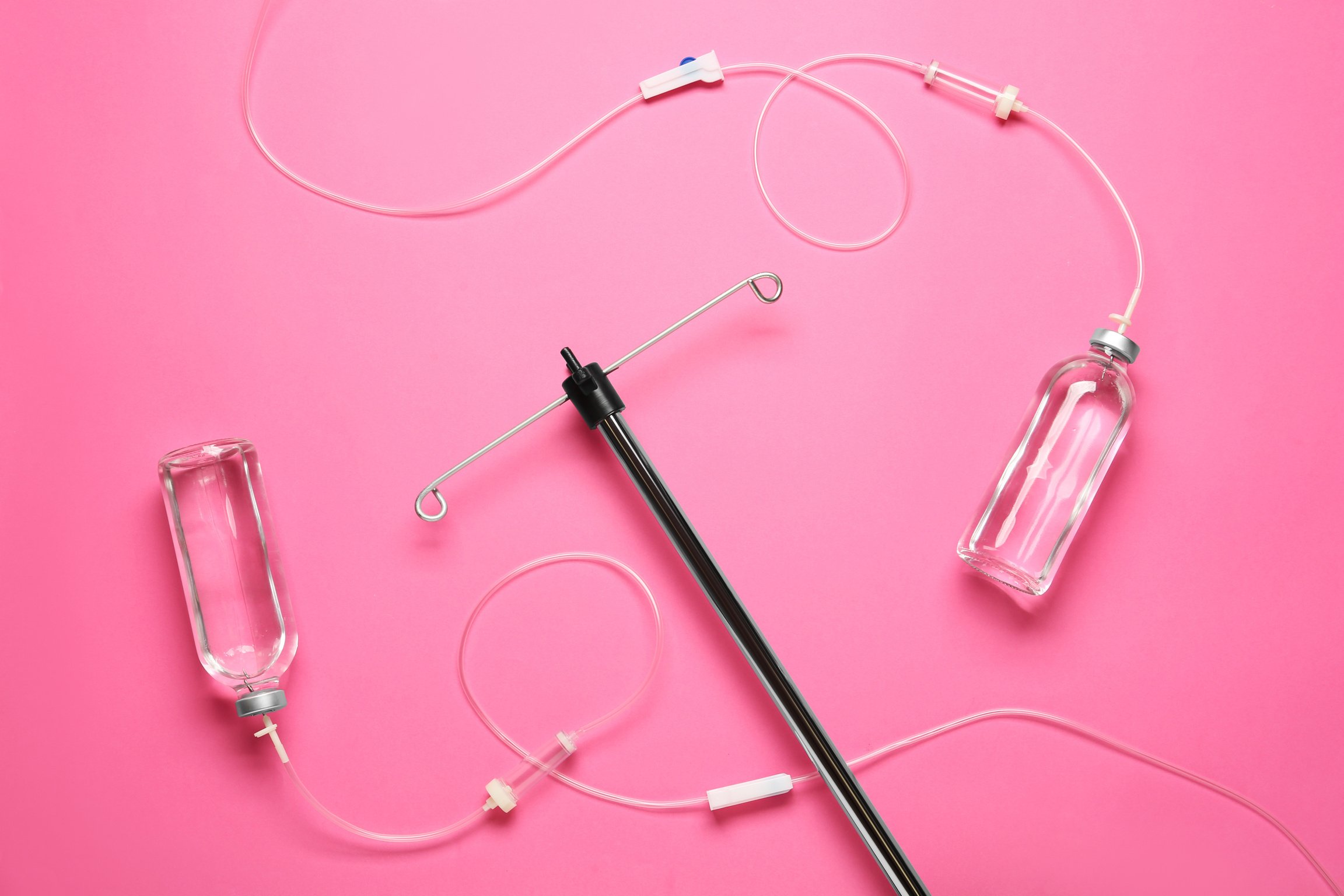 IV Infusion Set on Pink Background, Flat Lay